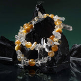 Lumi Reiki Yellow Rutilated Abundance Bracelet on a Model's Wrist - Stylish Jewelry for Wealth Attraction and Positive Energy