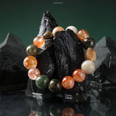 Peaceful Phantom Bracelet with mixed crystals featuring Phantom Free-form, Black Gold Super, Red Flower, and Pink Firework beads.