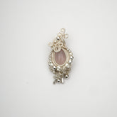 Pink Chalcedony Wishing Hand Necklace featuring a hand-wired silver design with a polished pink chalcedony stone.