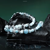 Lumi Reiki Aquamarine Topaz Fortune Necklace on a Model - Stylish Jewelry for Creativity, Confidence, and Good Luck