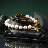 Pearl Tranquil Necklace with 10-11mm pearls and 4x13mm cylinders, symbolizing elegance and aura purification.