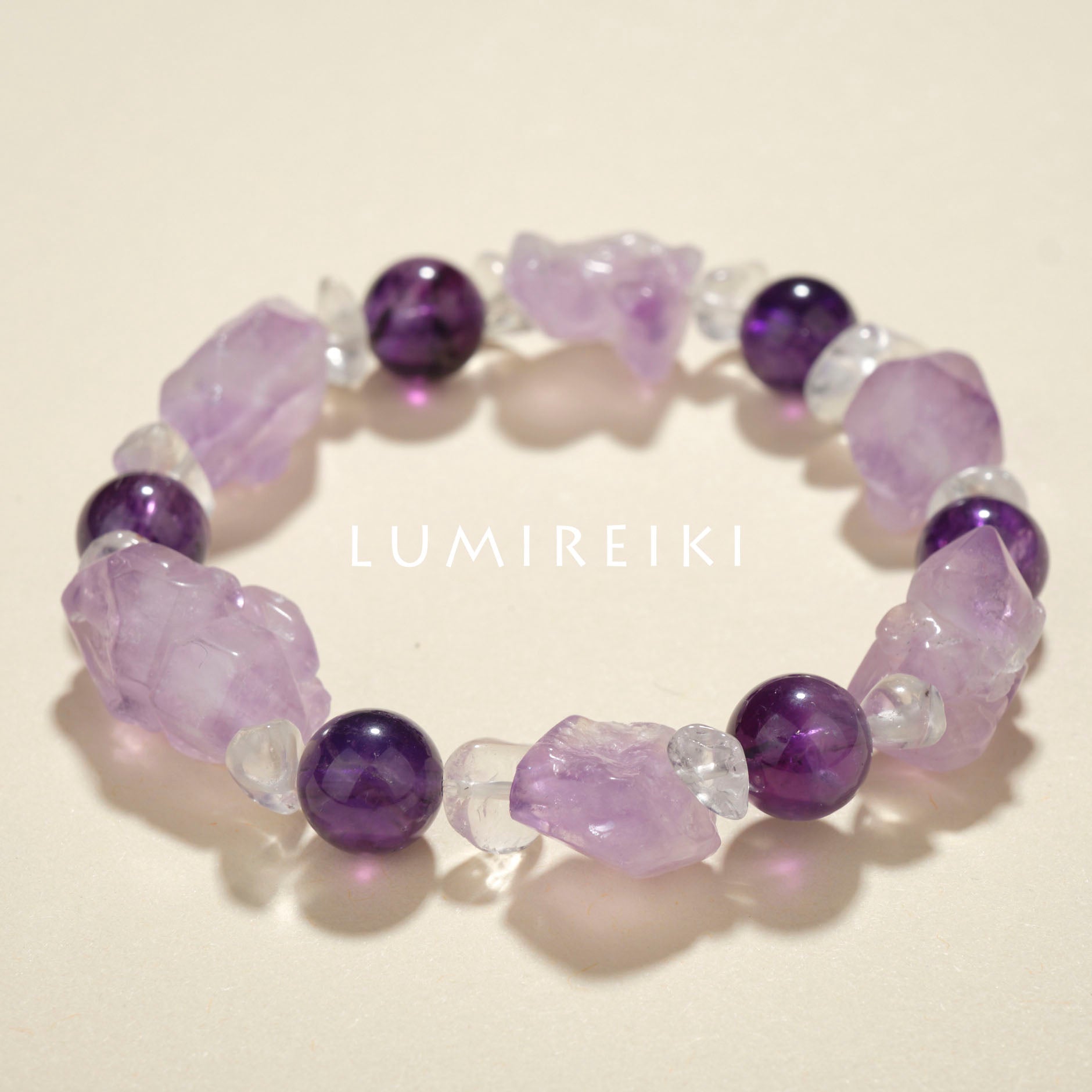 Amethyst Stress Relief Bracelet with irregular amethyst stones, 9.8mm beads, and clear quartz for calm and clarity.
